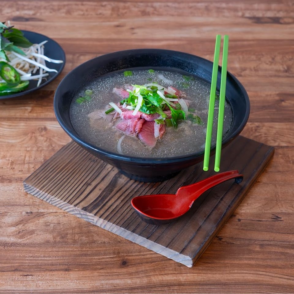 PhoEver Encinitas pho with beef, green onions, and cilantro, with a side of bean sprouts and jalapeños.